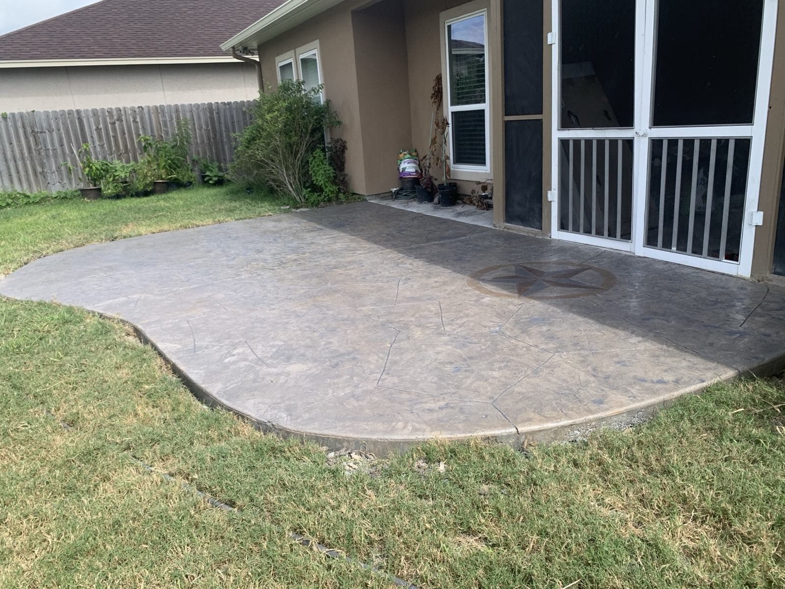 Curved patio finished with a stamped overlay