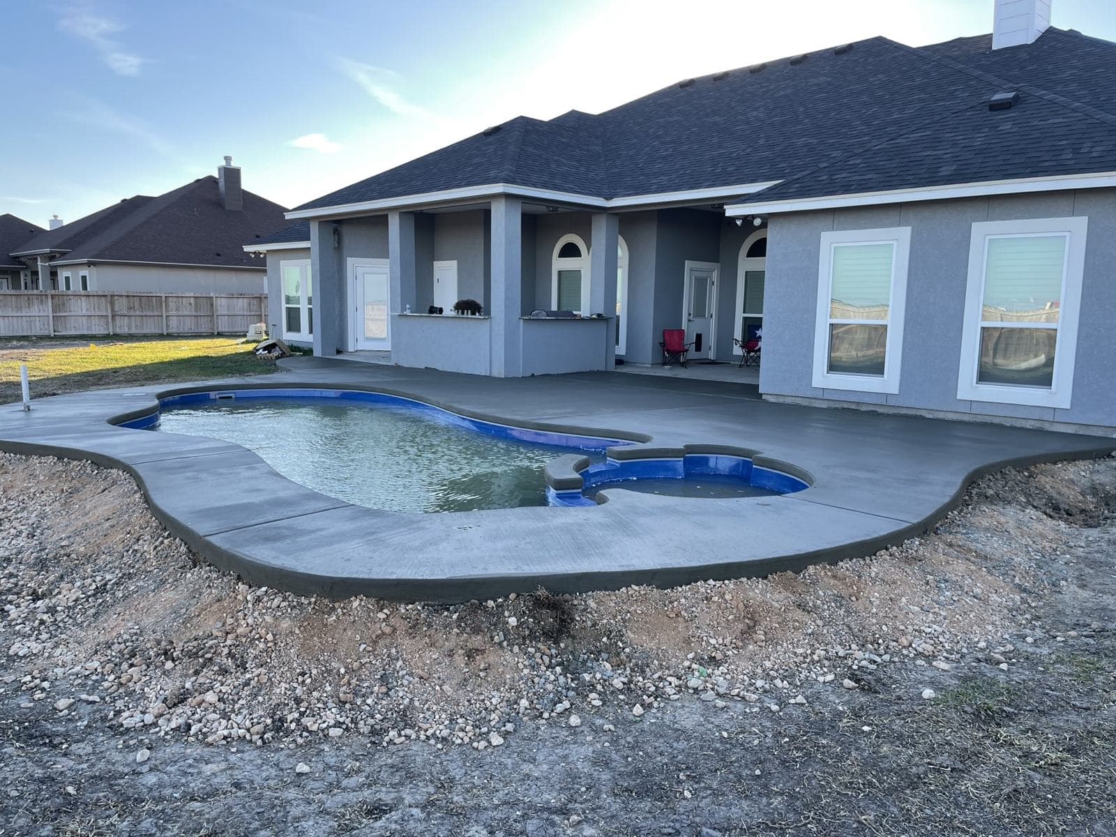 Pool deck being built around a new fiberglass pool