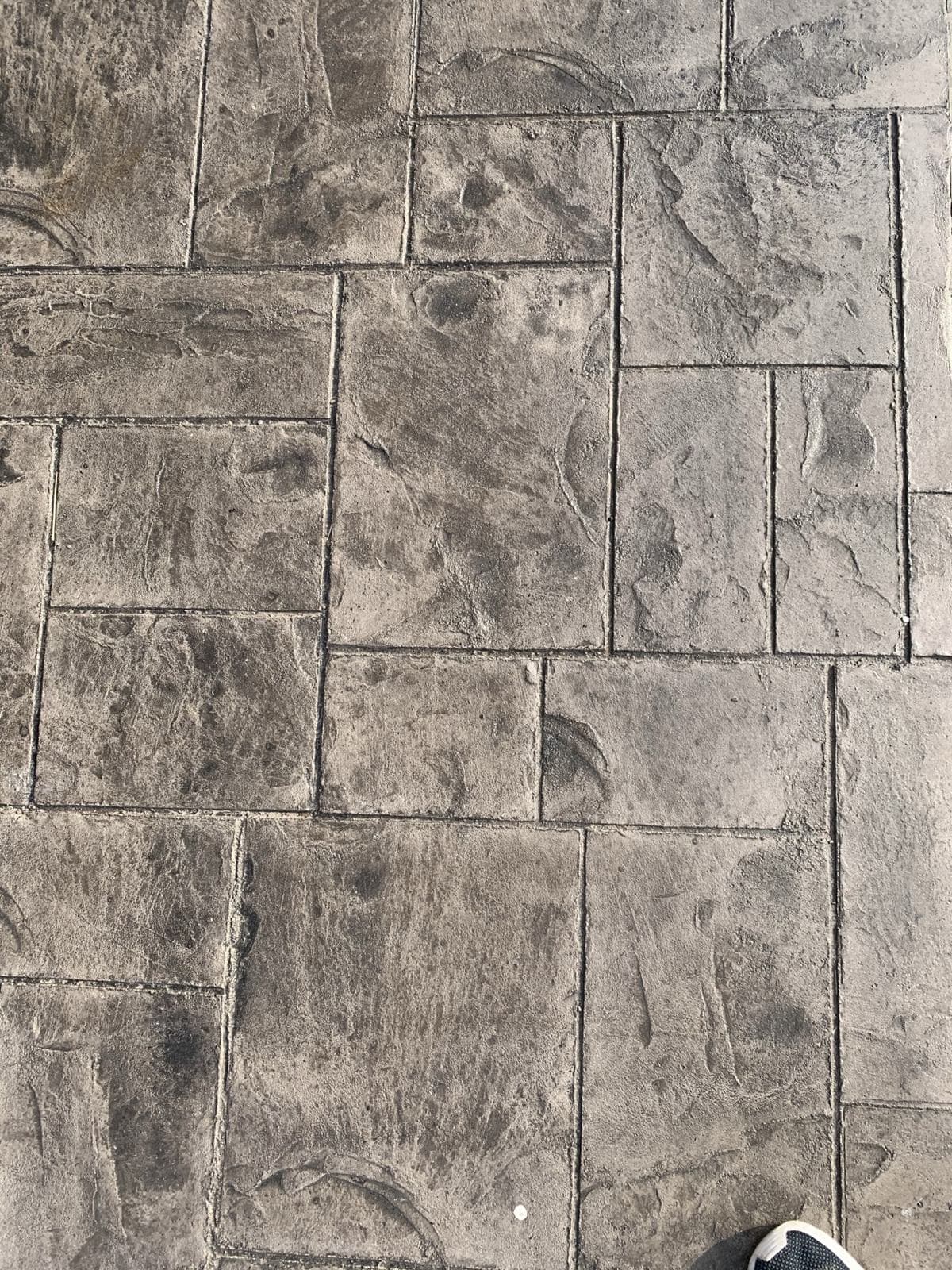 Close-up of ashlar slate stamped concrete in gray and tan