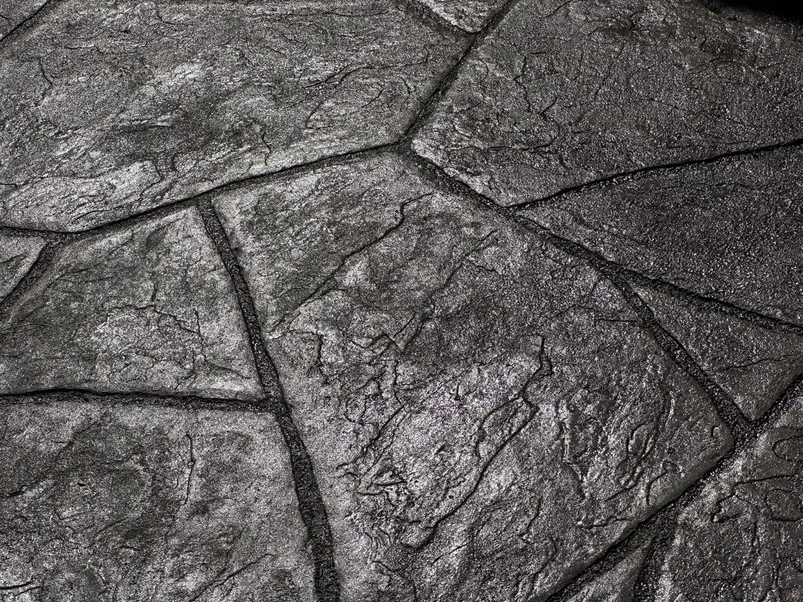 Close-up of large-format stone stamped concrete