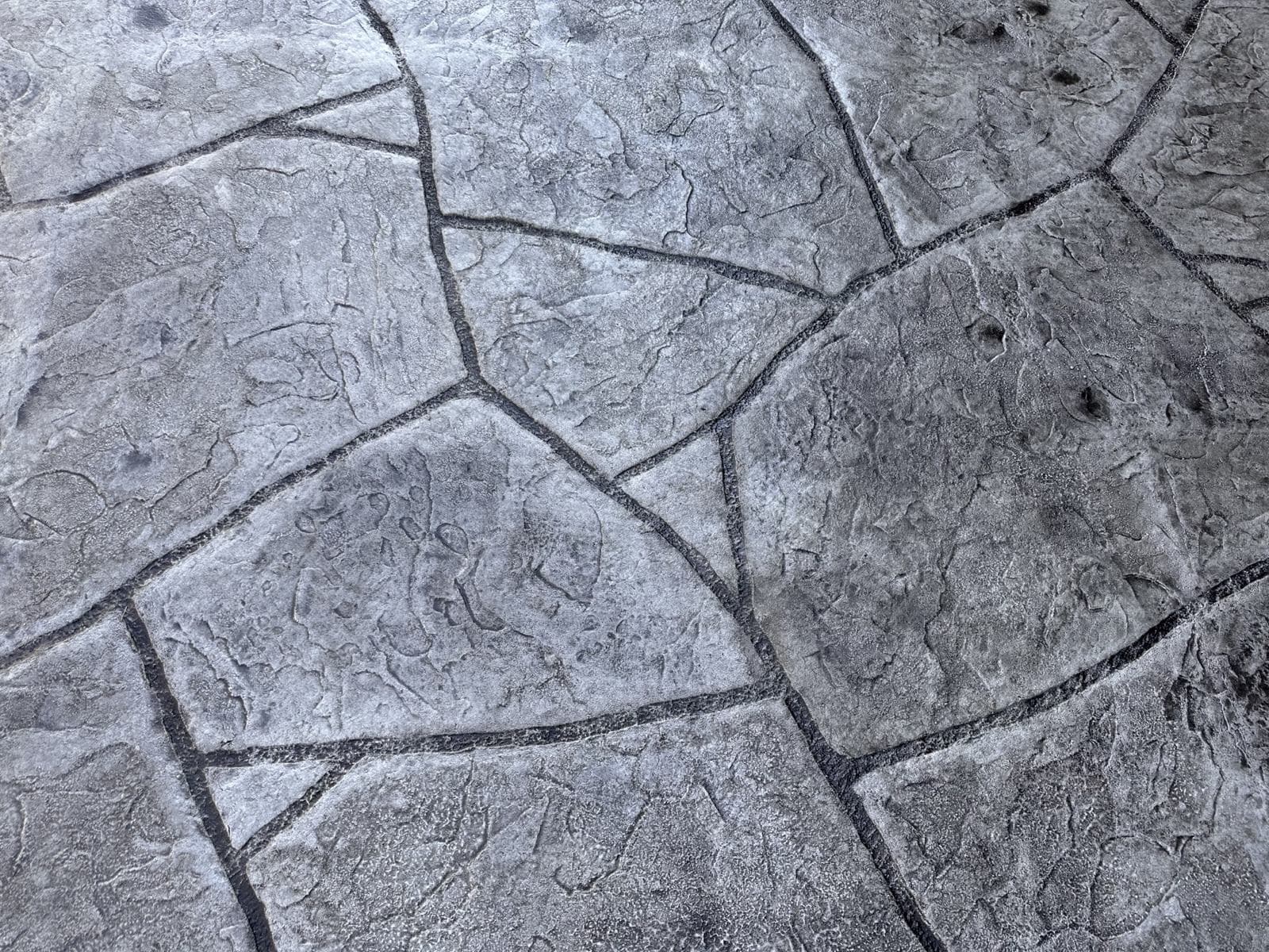 Gray random-stone stamped concrete close-up