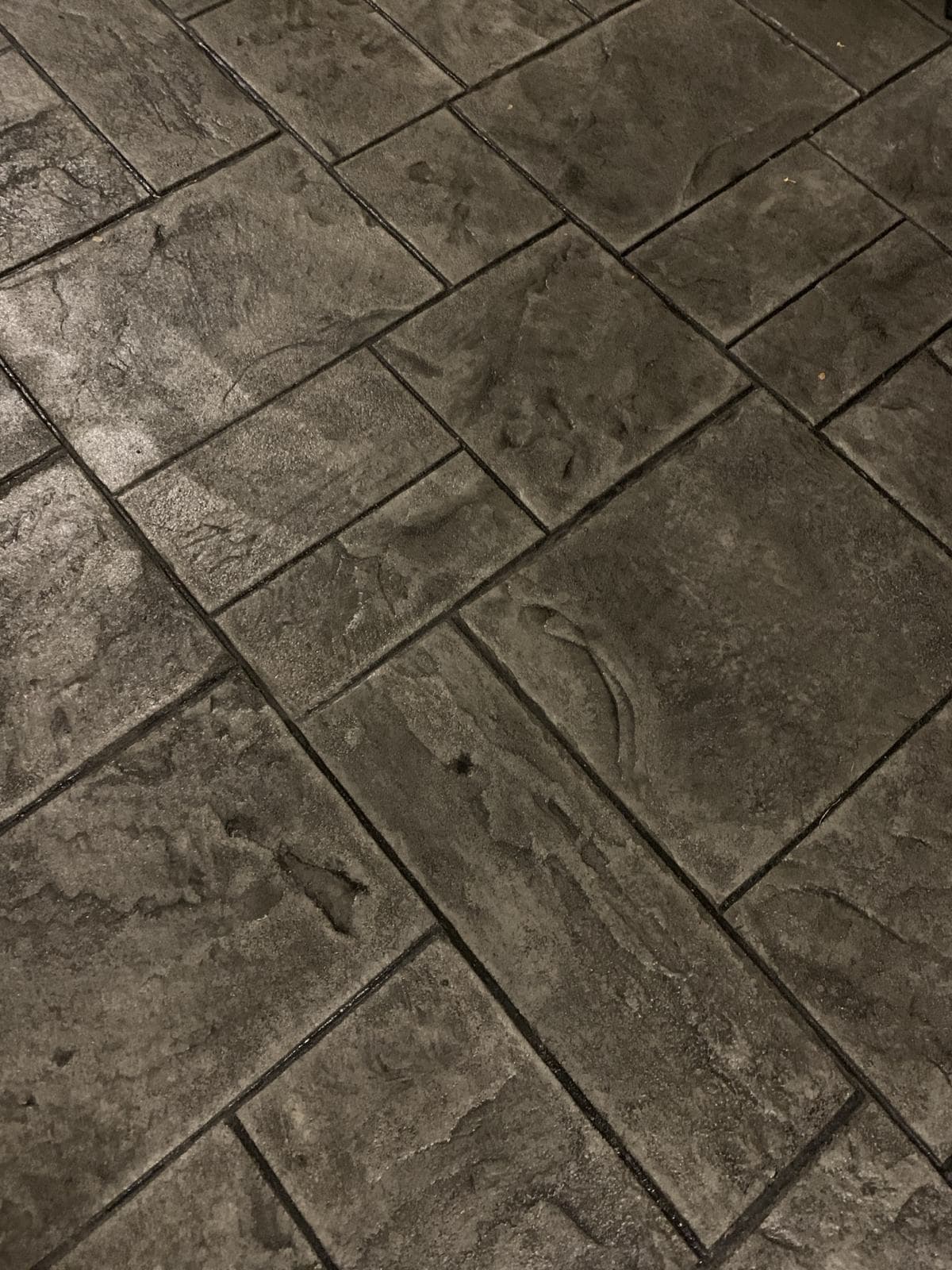 Stamped concrete in a tile grid pattern